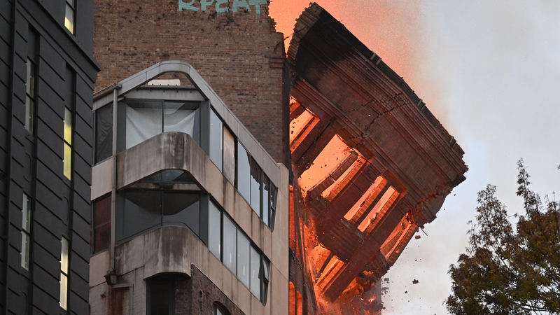 Part of the building has collapsed onto the street