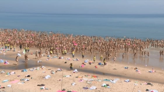 Women take part in the World's Largest Skinny Dip at Magheramore Beach, County Wicklow, 2018