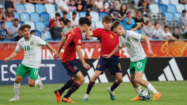 Ireland's Mason Melia in action against Jon Martín Vicente and Pau Prim Coma