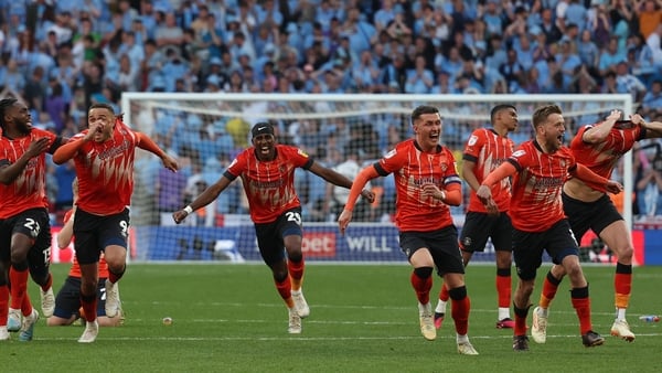 Luton's players celebrate after winning the penalty shoot-out