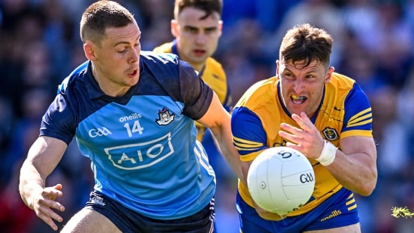 Roscommon forward Diarmuid Murtagh is tackled by Con O'Callaghan