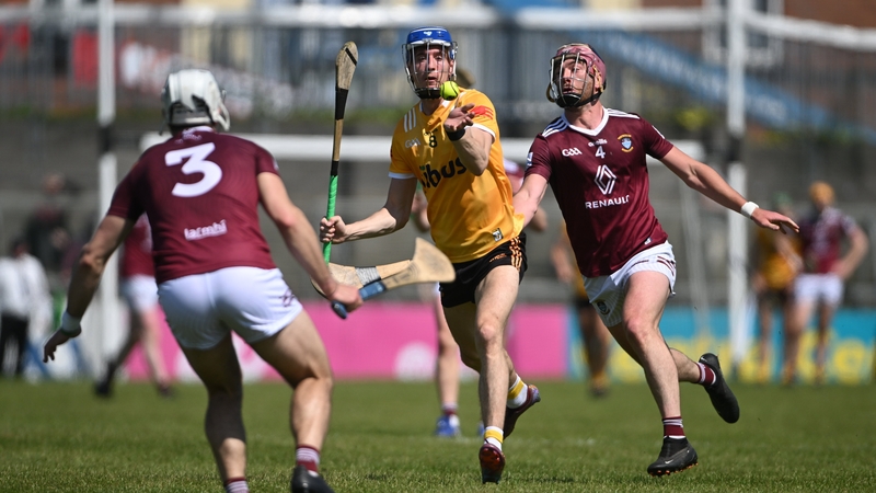 Antrim's James McNaughton comes under pressure from Westmeath's Conor Shaw, left, and Johnny Bermingham