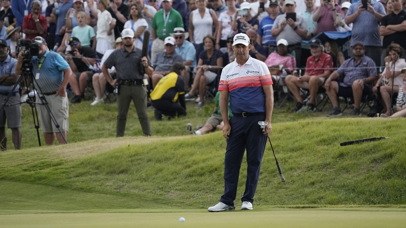 Padraig Harrington watches his putt on the 18th