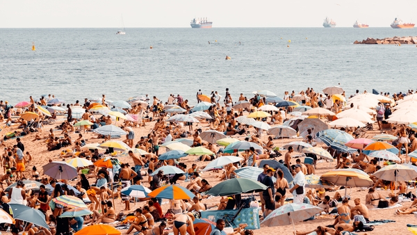 A crowded beach in Barcelona. Photo: Getty Images.