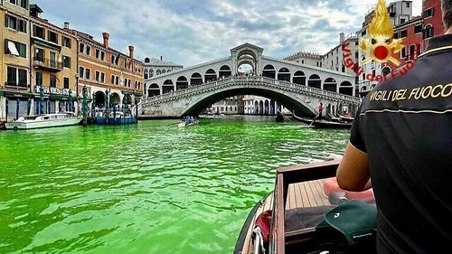 Residents noticed a stretch of the water turned bright green yesterday (Pic: Italian fire service)