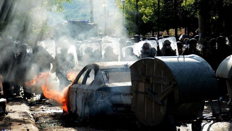 Kosovo riot police and NATO peacekeepers, secure an entrance to the municipal building in Zvecan, northern Kosovo