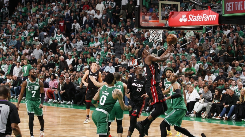 Miami Heat's Jimmy Butler drives to the basket at TD Garden