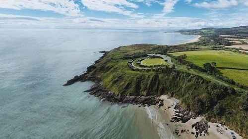The development was planned for a cliff top overlooking Magheramore beach
