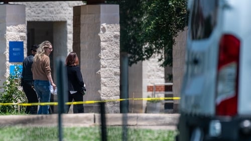 Elizabeth Holmes (centre) arriving at the prison in Texas earlier today