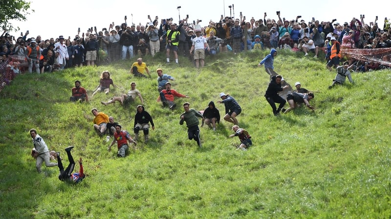 Competitors chasing the wheel of Double Gloucester