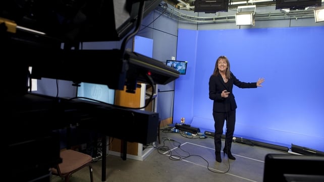 Evelyn Cusack stands in front of a blue screen as she presents the weather forecast in an RTÉ Television studio in October 2016.
