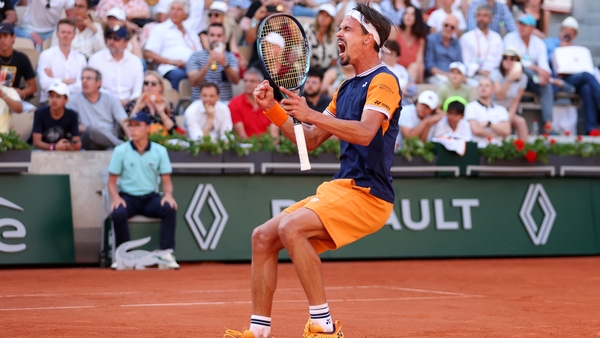 Daniel Altmaier celebrates winning match point against Jannik Sinner