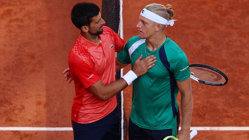 Novak Djokovic of Serbia (L) shakes hands with Alejandro Davidovich Fokina of Spain