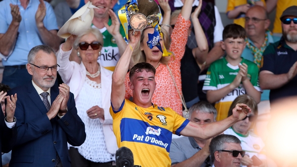 Clare captain Eoghan Gunning lifts the cup