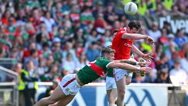 Tommy Durnin of Louth in action against Jordan Flynn