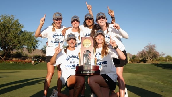 The Wake Forest Demon Deacons, including Lauren Walsh (back row, far right) celebrate with the trophy after winning the NCAA Women's Golf Championships at Grayhawk