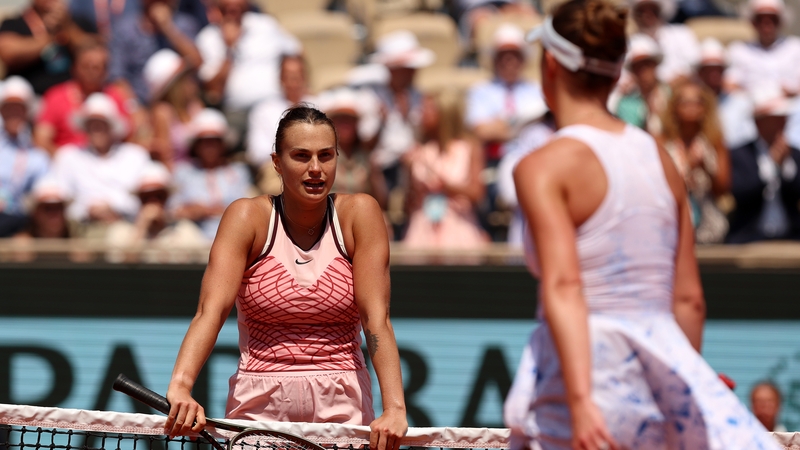 Aryna Sabalenka waits at the net for a handshake she was aware would never materialise