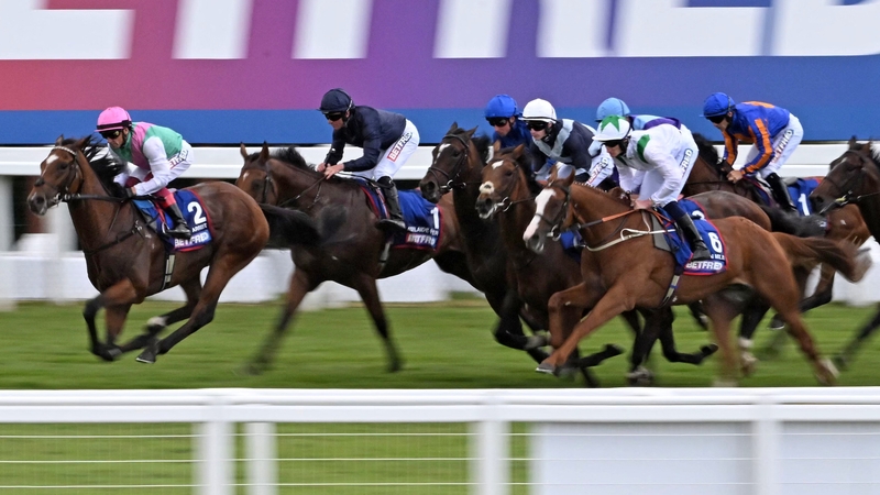 Frankie Dettori (L) riding Arrest while leading at the start of the Derby which ultimately ended with a 10th place finish