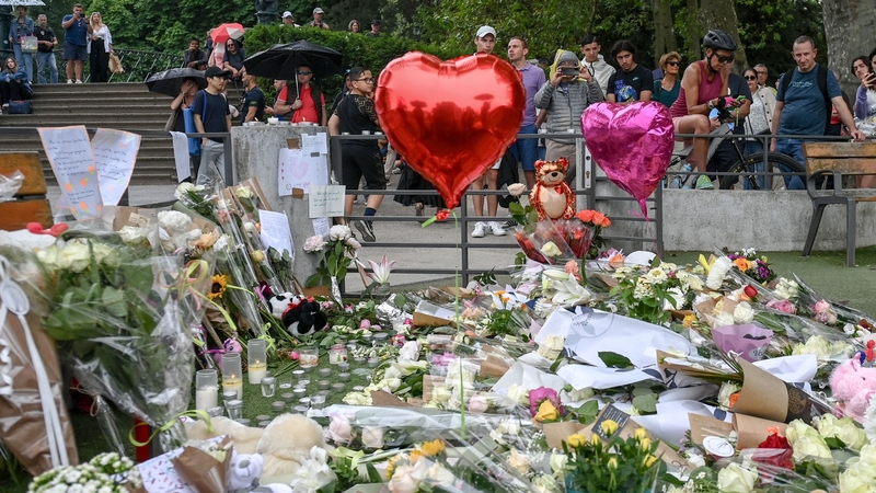 Flowers, balloons and candles at the park in Annecy where the attack occurred