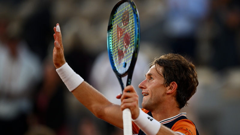 Casper Ruud celebrates winning match point against Alexander Zverev