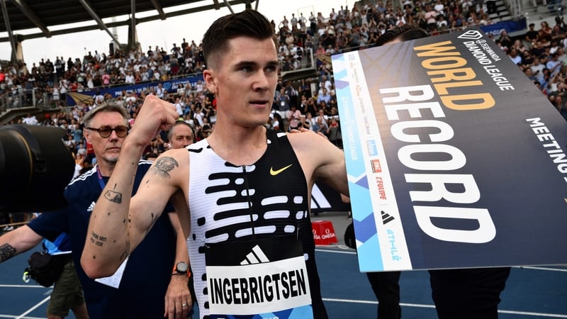 Jakob Ingebrigtsen celebrates after breaking the world record in the men's two mile event