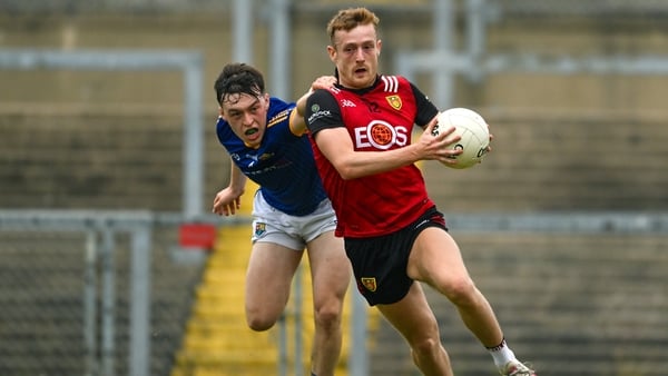 Down's Liam Kerr goes on the attack with Longford's Bryan Masterson giving chase