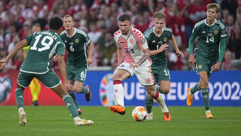 Pierre-Emile Højbjerg of Denmark is surrounded by Northern Ireland players