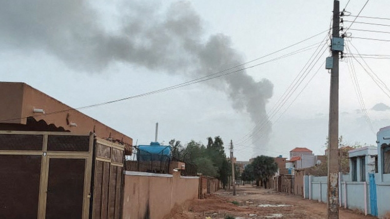 Smoke billows in the distance amid ongoing fighting in Khartoum