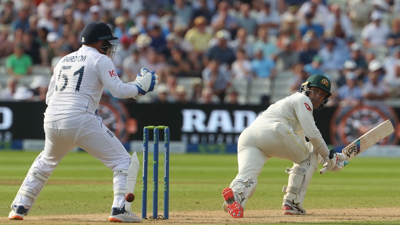 Australia's wicket keeper Alex Carey (R) plays a shot on day two of the first Ashes cricket Test match between England and Australia at Edgbaston