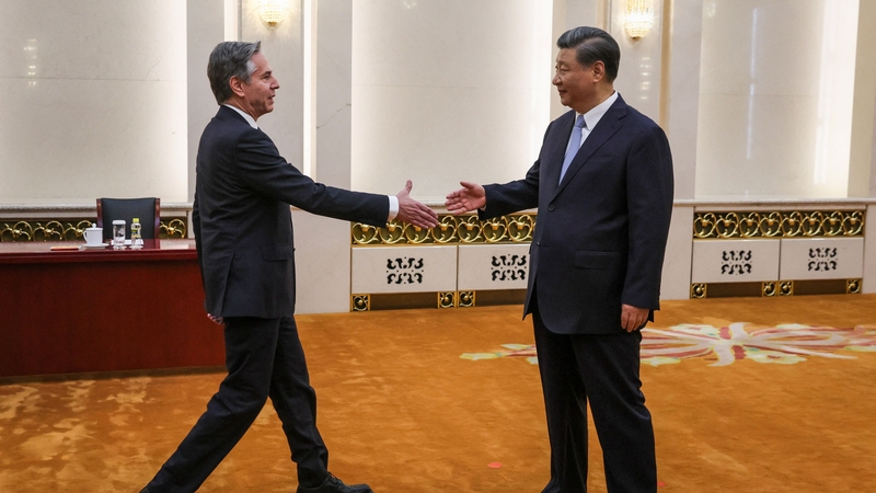 US Secretary of State Antony Blinken (L) shakes hands with China's President Xi Jinping in the Great Hall of the People in Beijing