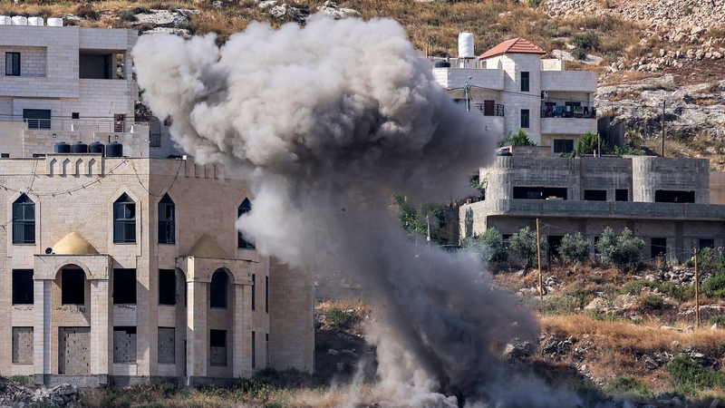 Smoke billows from an Israeli rocket's impact explosion during an army raid in Jenin in the occupied West Bank
