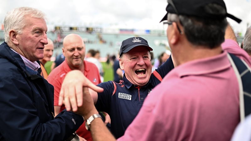 Cork manager John Cleary celebrates Sunday's victory with supporters