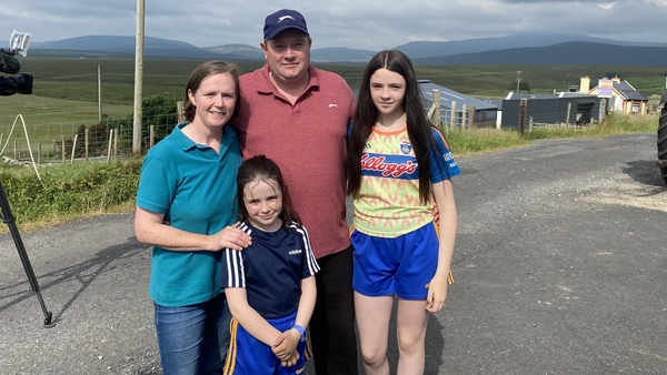 Gary and Breege Ginty with two of their three children on their farm at Ballycroy