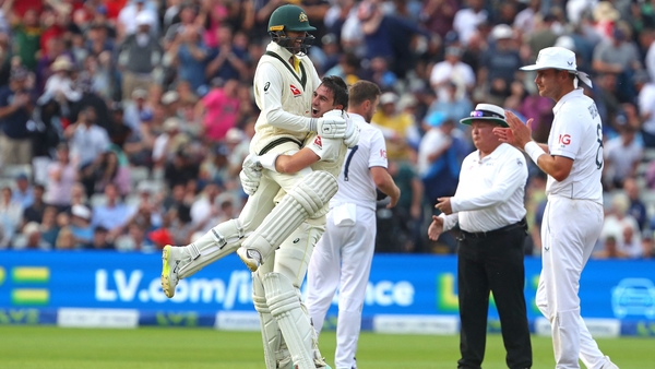 Pat Cummins and Nathan Lyon celebrate as Australia celebrate a thrilling Test match win in Edgebaston