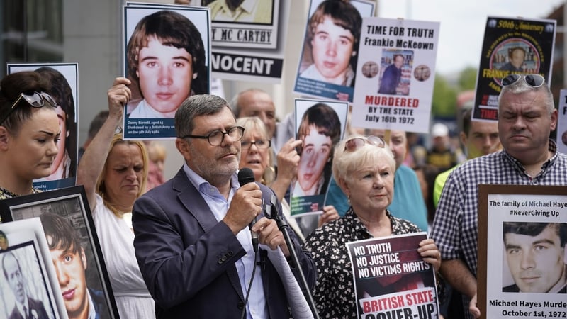 Mark Thompson (C), of Relatives for Justice, speaking at a protest in Belfast