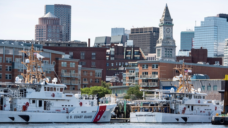 Crews work on Coast Guard vessels at Coast Guard Base Boston