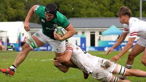 Ruadhan Quinn is tackled by Finn Carnduff