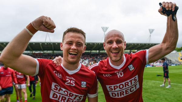 Steven Sherlock and Brian O'Driscoll celebrate Cork's win