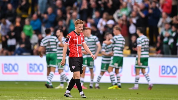 Rovers players celebrate as former Hoop Brandon Kavanagh looks despondent after the crucial goal