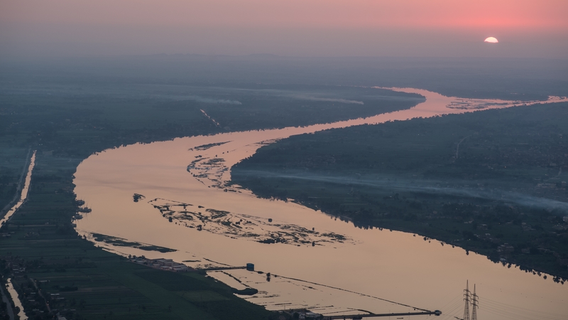 A view of the Nile river as the sun rises over Egypt