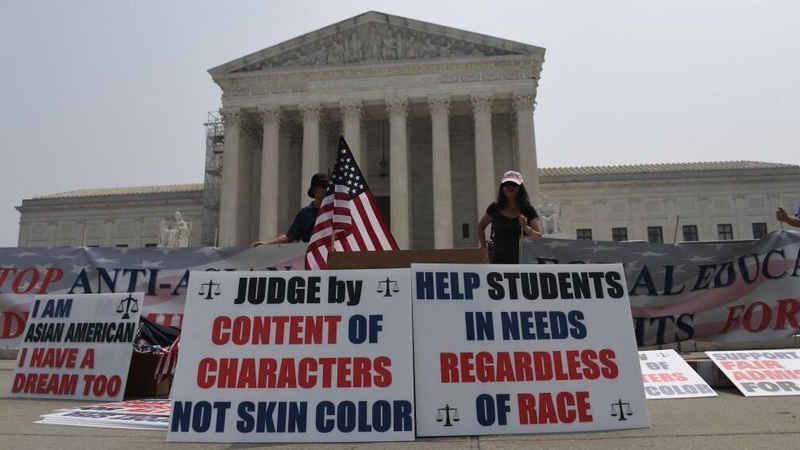 Demonstrators outside the court in Washington today