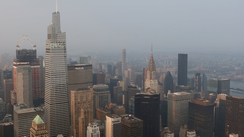 Smoke from wildfires in Canada shrouded buildings beyond midtown Manhattan yesterday