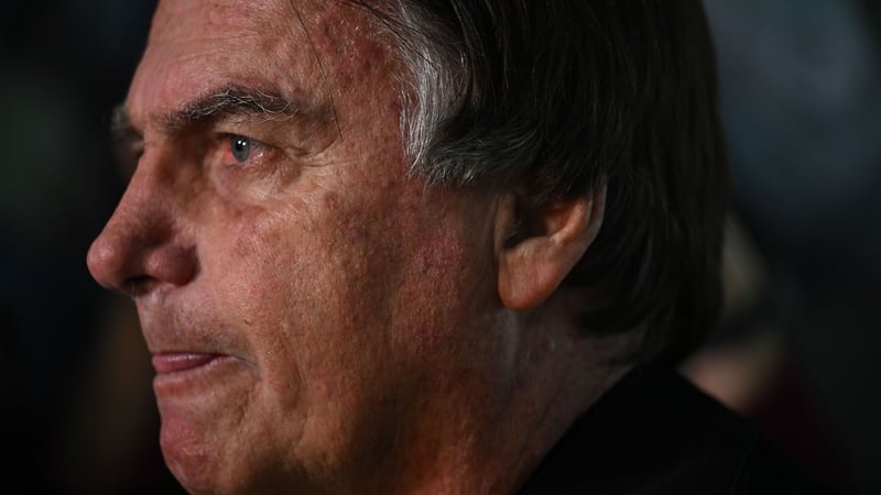 Former Brazilian President Jair Bolsonaro speaks to media at Santos Dumont Airport in Rio de Janeiro yesterday