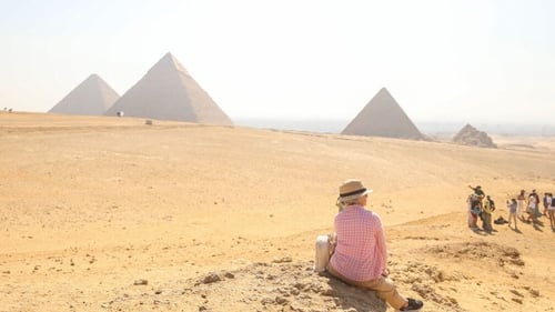 Tourists at the Pyramids of Giza, a UNESCO World Heritage Site
