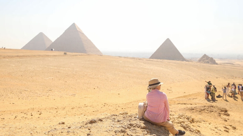 Tourists at the Pyramids of Giza, a UNESCO World Heritage Site