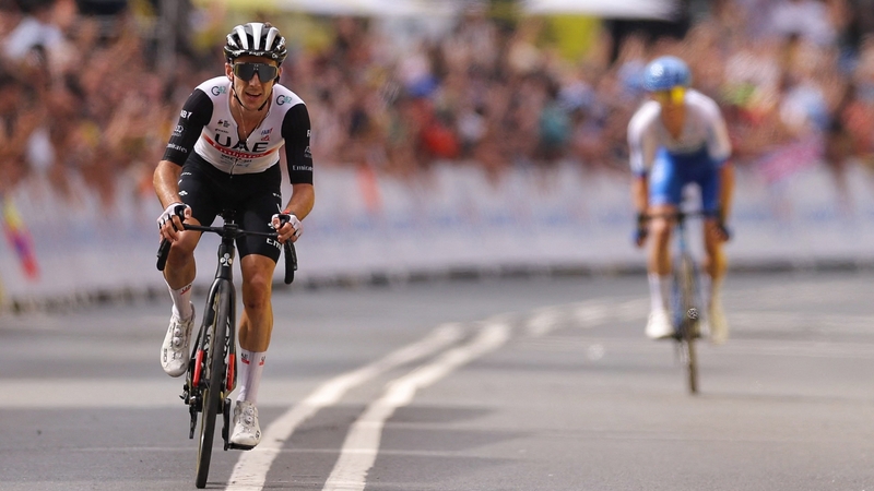 Adam Yates pulled away from twin brother Simon in the closing stages to claim the yellow jersey