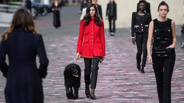 The fashion show took place on the banks of the Seine River in Paris.