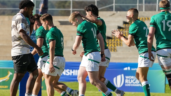 Andrew Osborne (centre) scored the pick of Ireland's seven tries