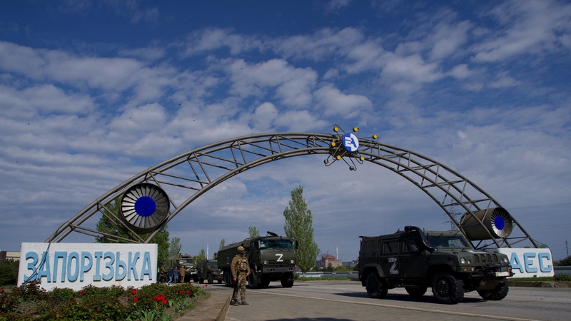 Russian military vehicles drive through the gates of the Zaporizhzhia Nuclear Power Station on 1 May, 2022