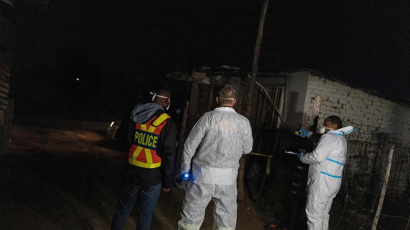 South African police near the scene of the toxic gas leak at the Angelo informal settlement